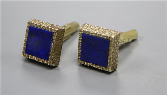 A pair of 1970s textured 9ct gold and lapis lazuli set cufflinks, gross weight 13 grams.